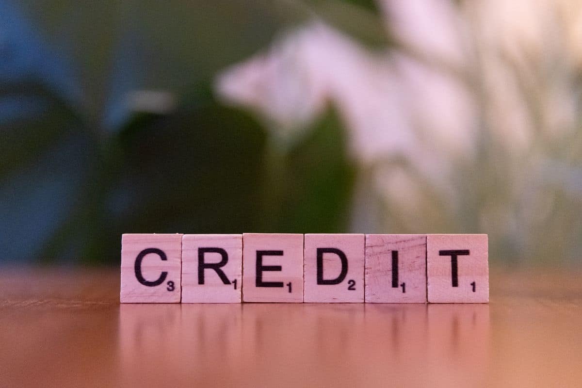 Credit score report used to track progress while building credit fast