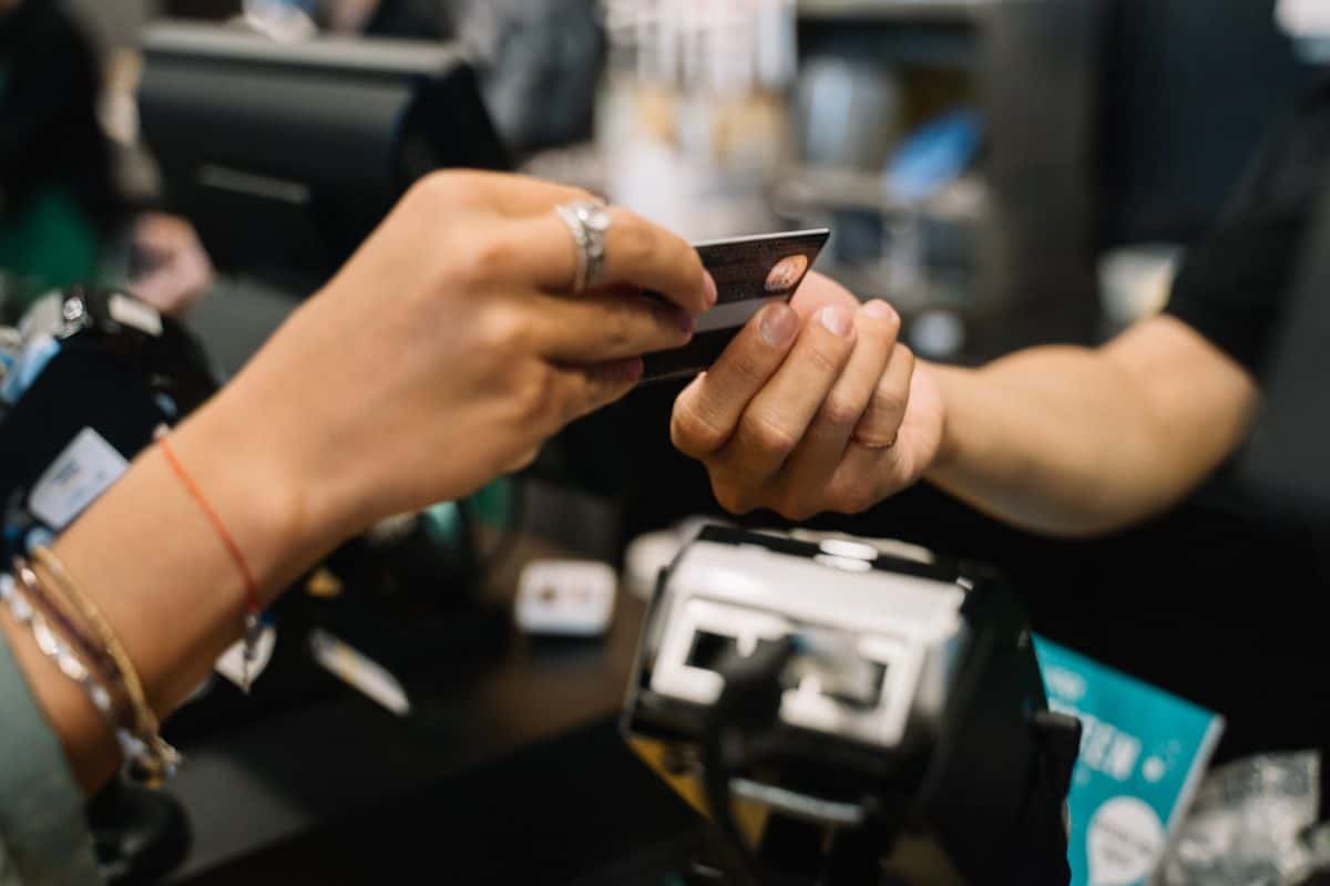 Close-up of a credit card representing the choice between a personal loan and credit card financing