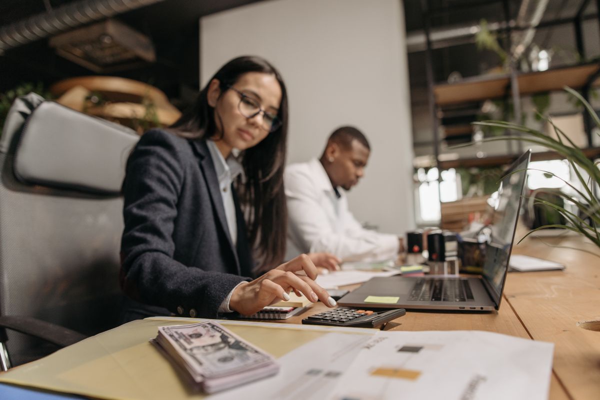 Business owner reviewing accounting records related to S-corp election tax savings